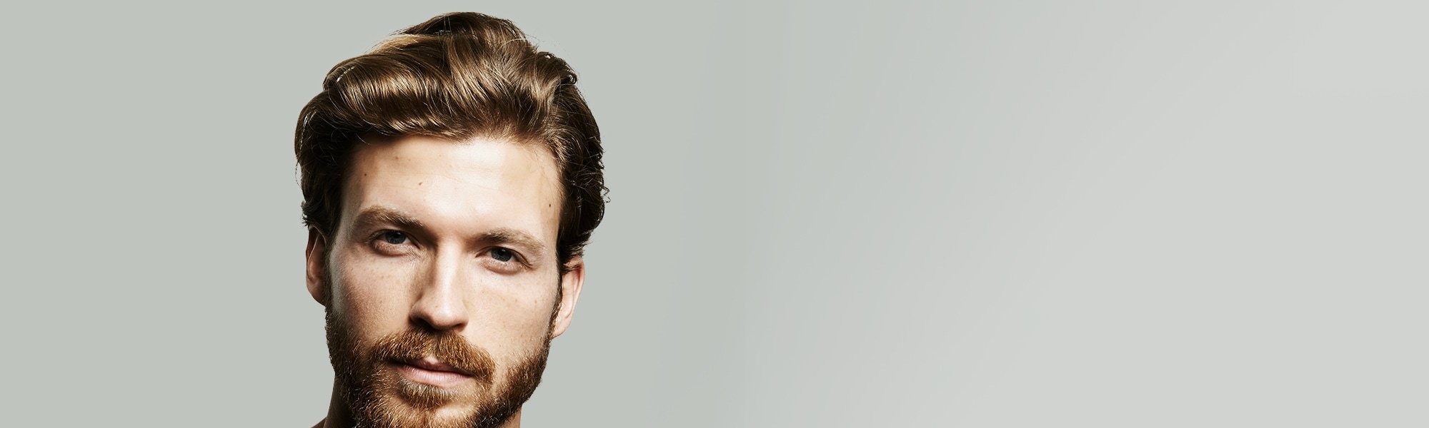 L'Oréal Men Expert Hero - Mann mit Bart schaut bestimmt.