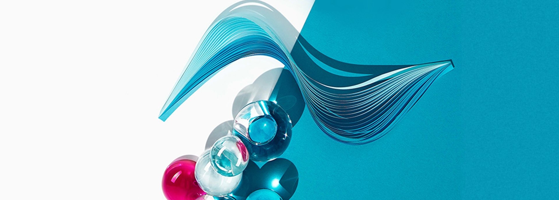 Blaue, rote und durchsichtige Kugeln auf blau-weißem Grund und geschwungene Darstellung von Filloxane