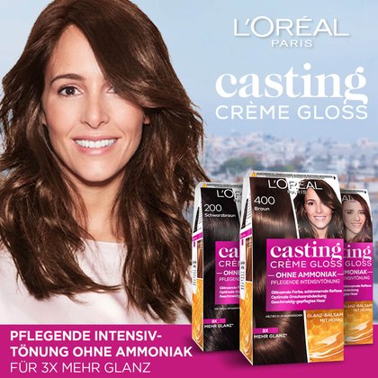 Drei Casting Creme Gloss Verpackungen und eine Frau im Hintergrund eine Stadt