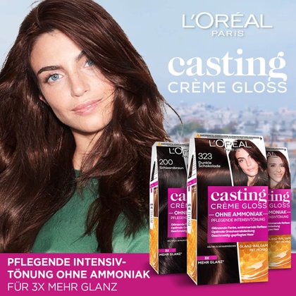 Drei Casting Creme Gloss Verpackungen und eine Frau im Hintergrund eine Stadt