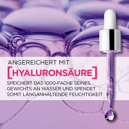 Pipette aus der eine violette Flüssigkeit ausgelassen wird